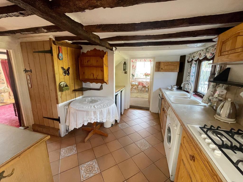 Lot: 147 - DETACHED TWO-BEDROOM COTTAGE IN POPULAR RESIDENTIAL LOCATION - Kitchen looking out over garden to rear